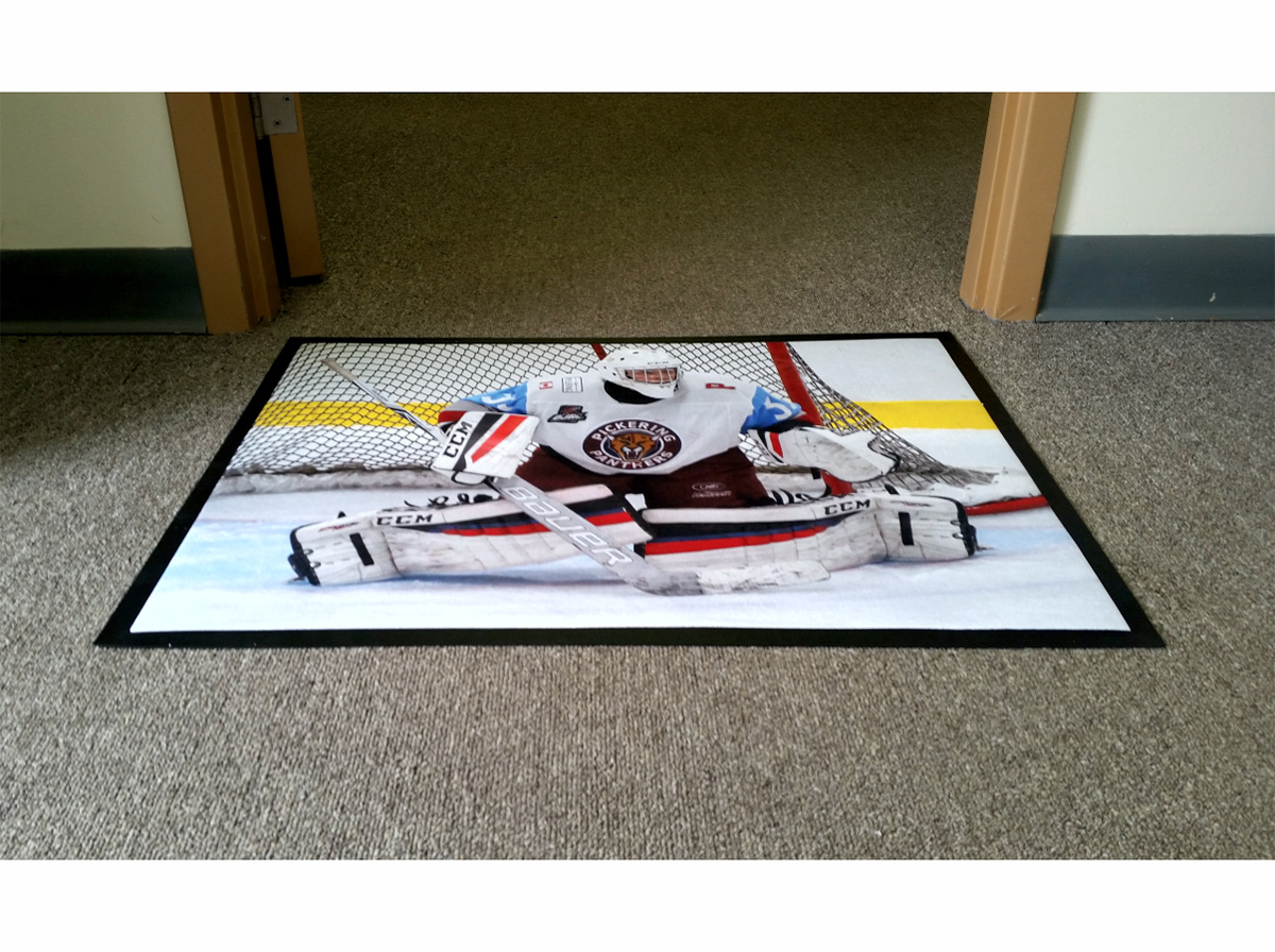 Floor mat with a hockey goalie image