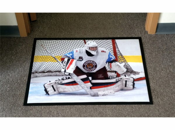 Floor mat with a hockey goalie in front of the net