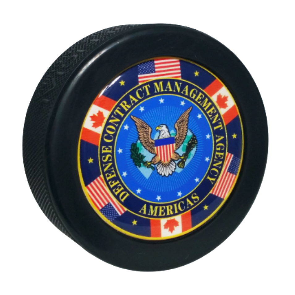Defence Contract Management Agency Americas logo on a domed hockey puck