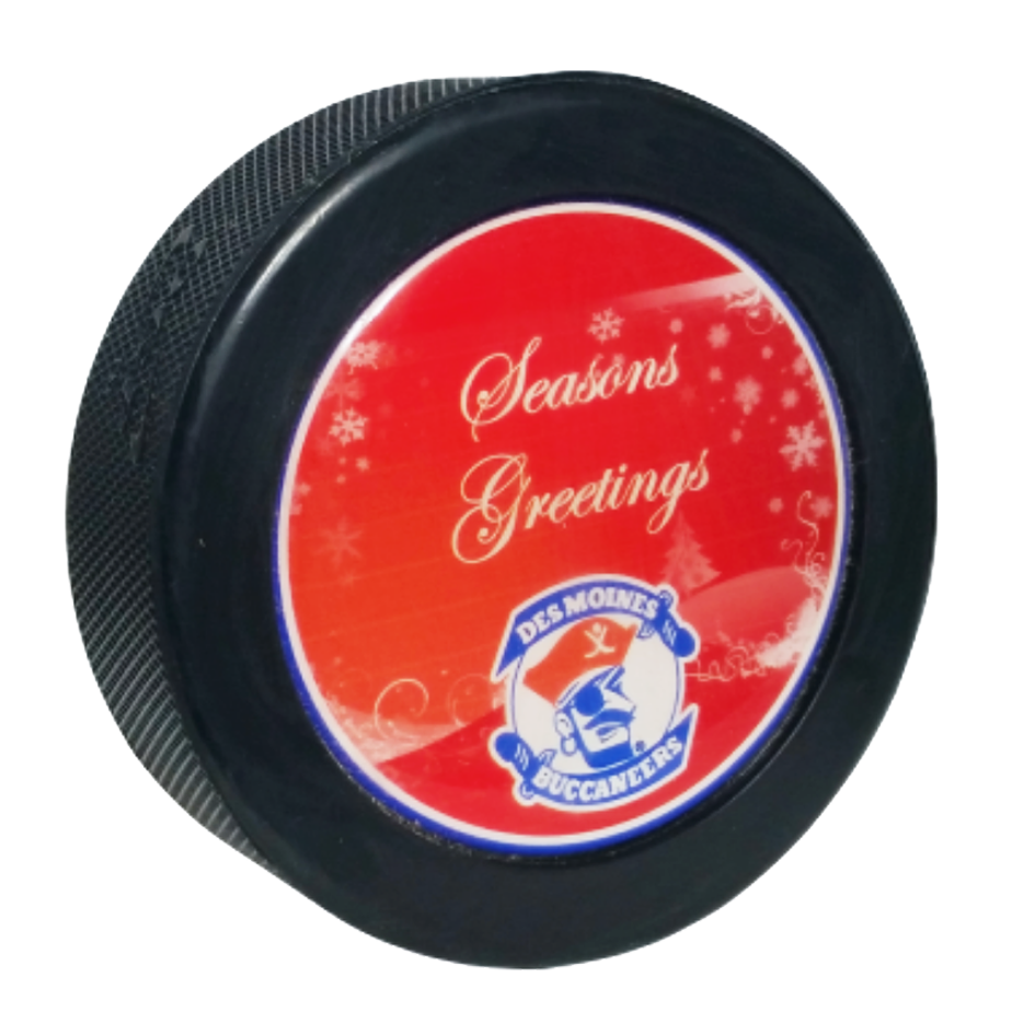 Domed hockey puck with a red “Season’s Greetings” Des Moines Buccaneers design