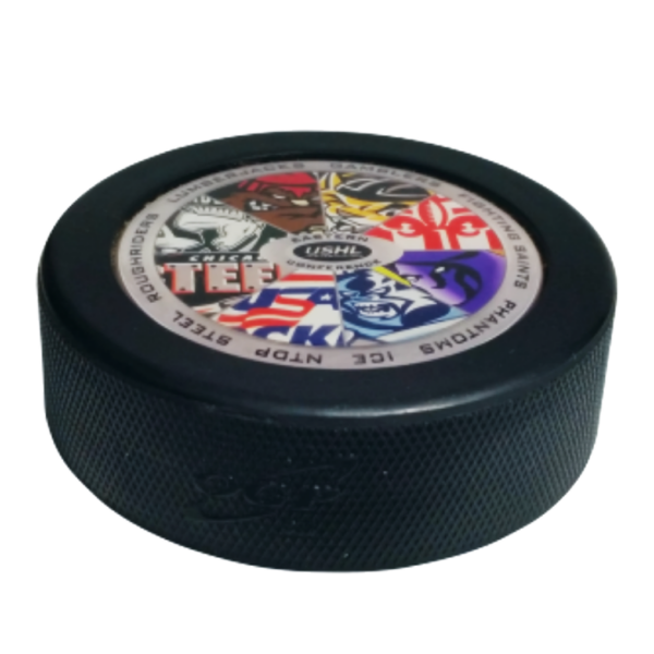 Domed hockey puck with a USHL logo and team crests on top