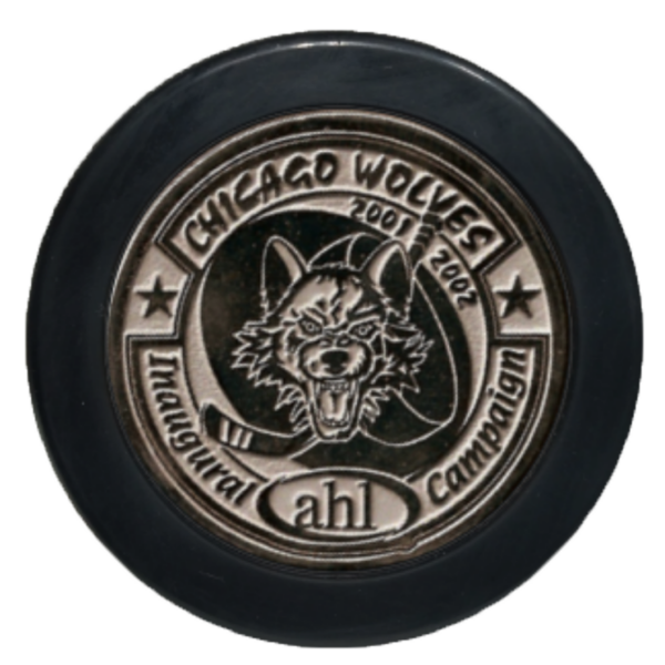 Chicago Wolves commemorative shiny silver medallion puck with wolf logo and 2001–2002 dates