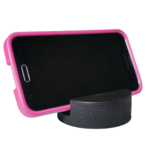 Smartphone in a pink protective case in a black puck holder