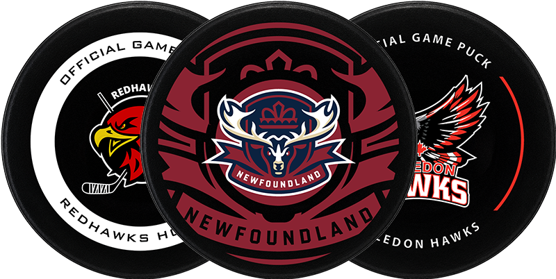 Three hockey pucks with Newfoundland and Redhawks logos